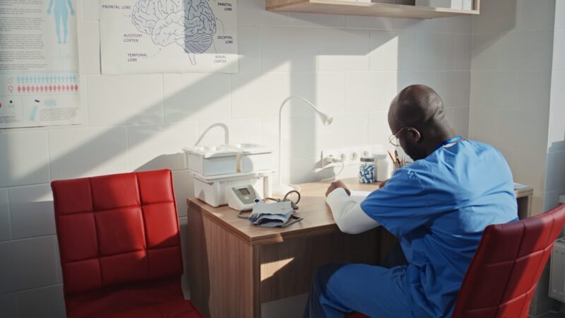 Nurse Sitting in a Doctor's Office. Concept for HIPAA Privacy Rules